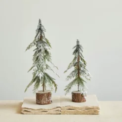 Storied Home Faux Fir Tree With Wood Base And Snow Finish, Green -Interio Store GUEST 150b25d0 5eb6 4ddf a26a 11cd9266288e